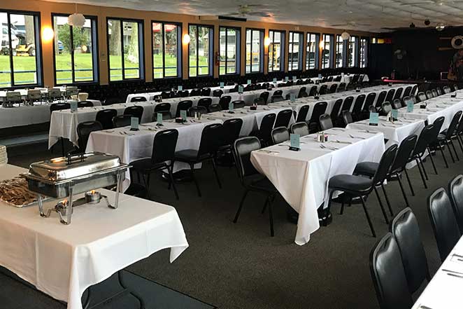 Guests enjoying a meal on a dinner cruise aboard The Madam Carroll
